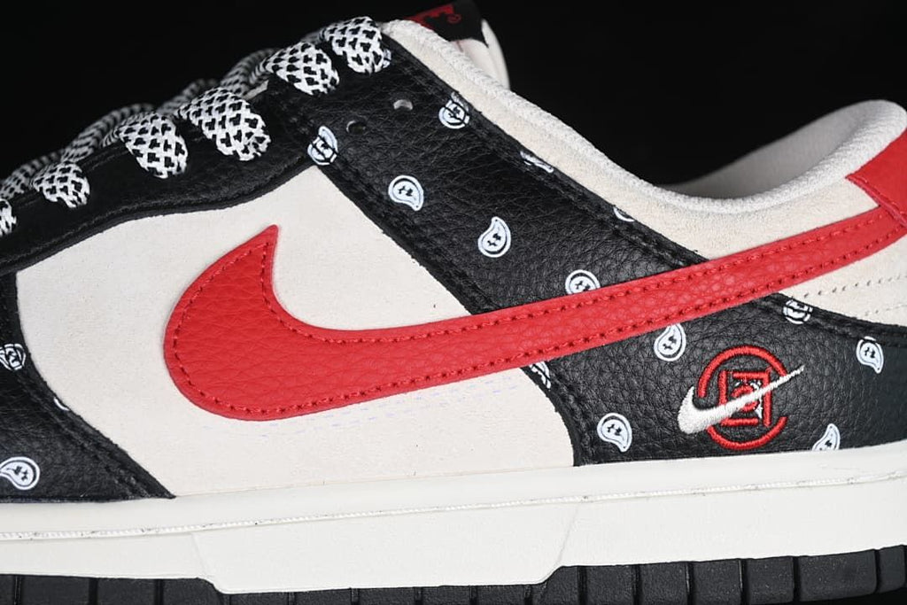 Close-up of the red Swoosh and paisley-patterned black overlays.