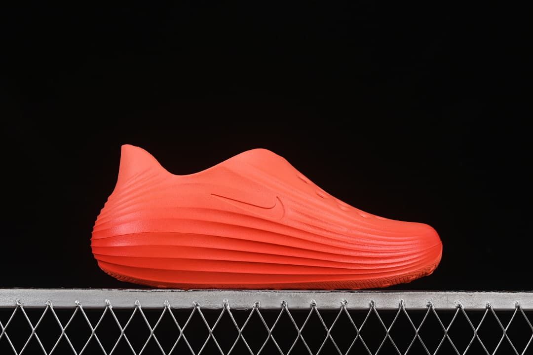 Side profile of the orange clog sandal