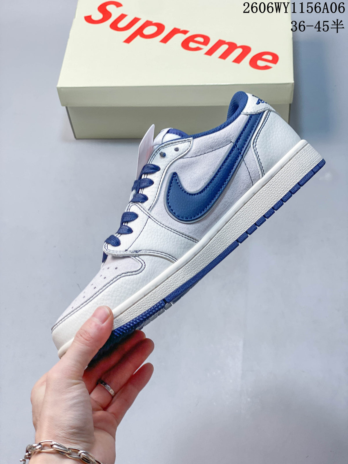 Side view of the white and blue low-top sneaker with a blue Swoosh