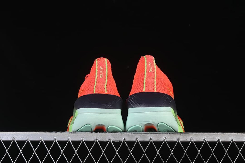 Rear view of the pair showing the heel and mint-green outsole