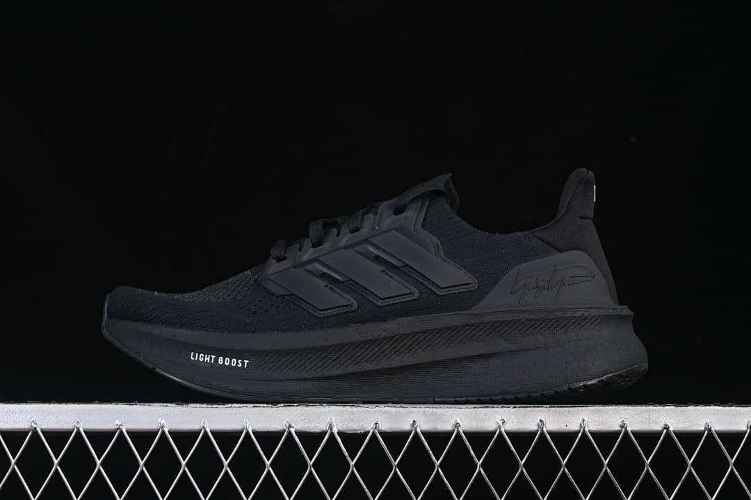 Side view of a black adidas Y-3 Ultraboost 5 shoe.