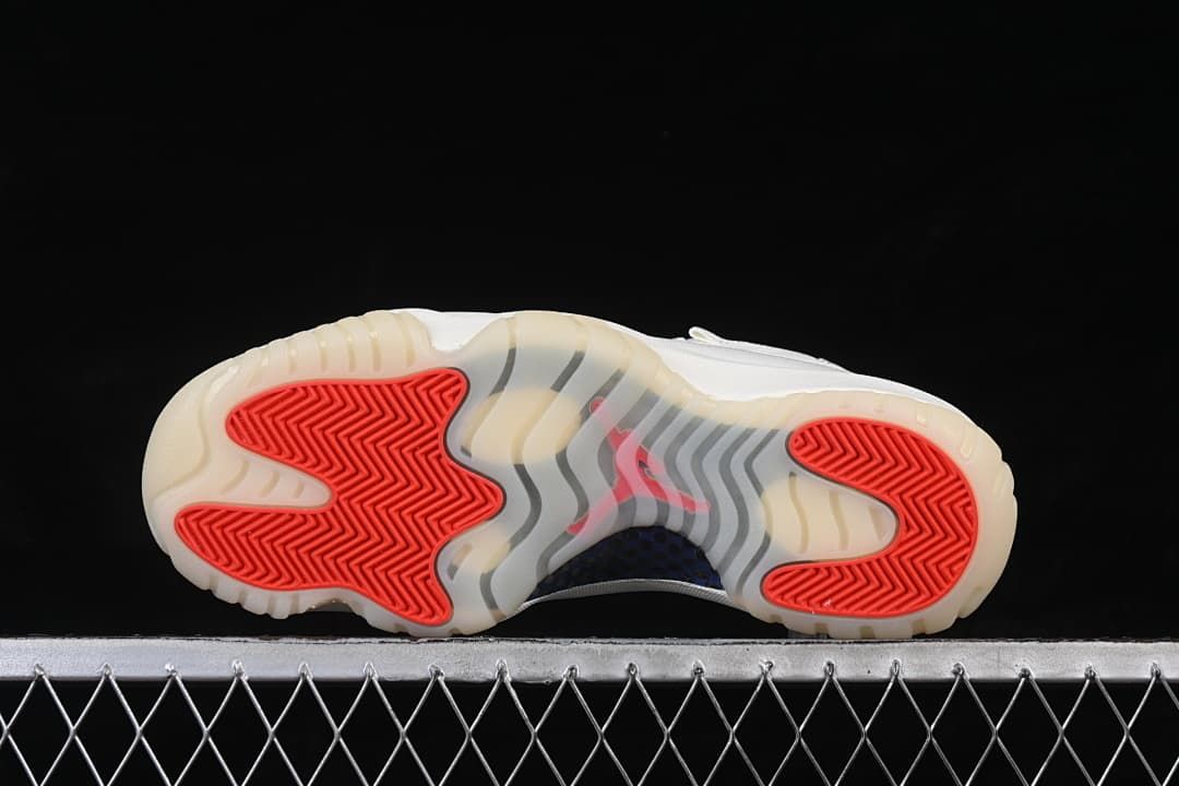 Outsole view showing translucent sections and red traction panels.