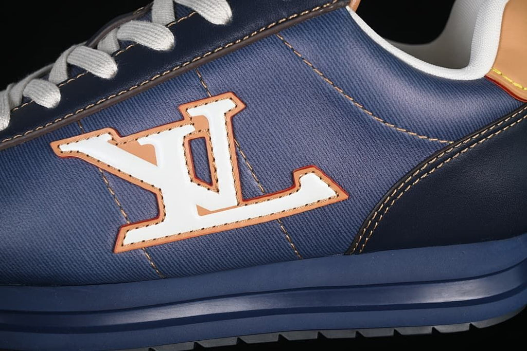 Close-up of the large side logo, blue panels, and layered sole