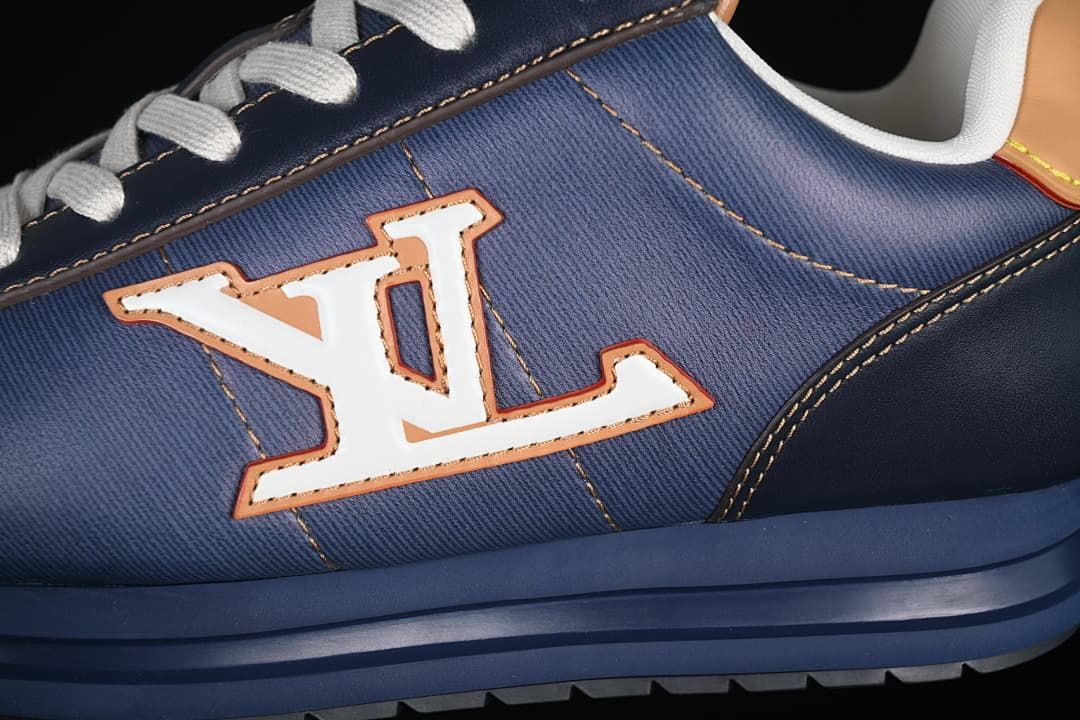 Close-up of the large side logo, blue panels, and layered sole