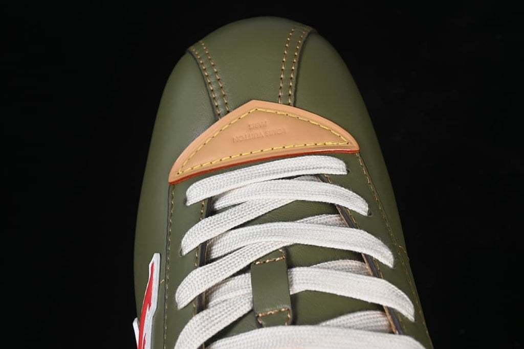 Top view of the sneaker toe, cream laces, and tan eyestay accent