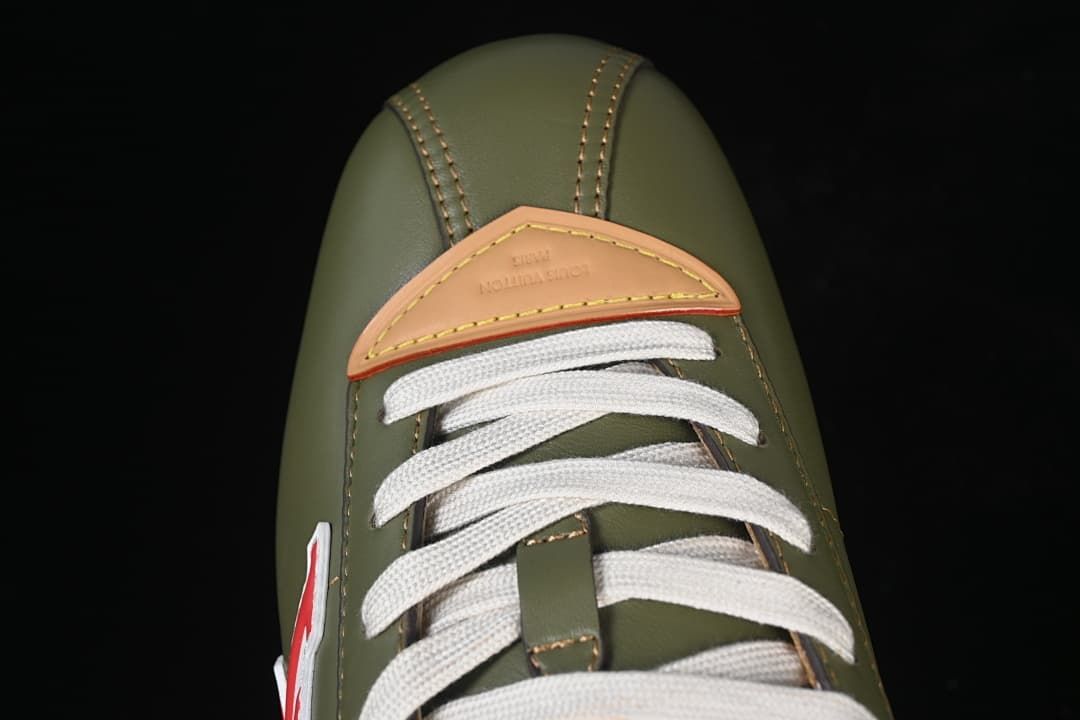 Top view of the sneaker toe, cream laces, and tan eyestay accent
