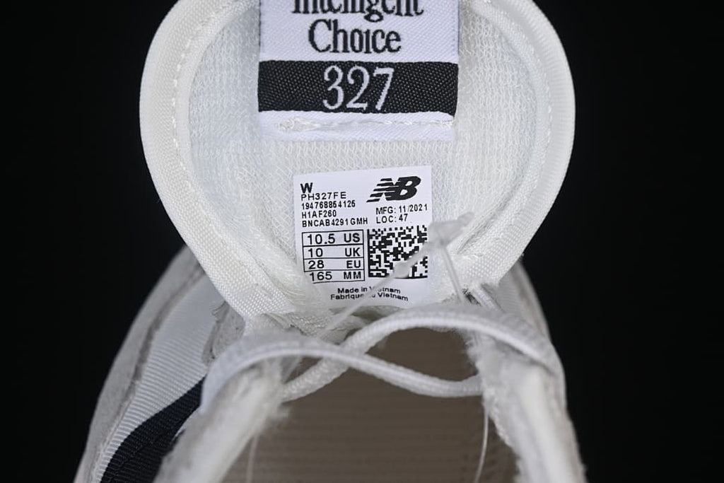 Tongue and size label showing model PH327FE and sample size EU 28.