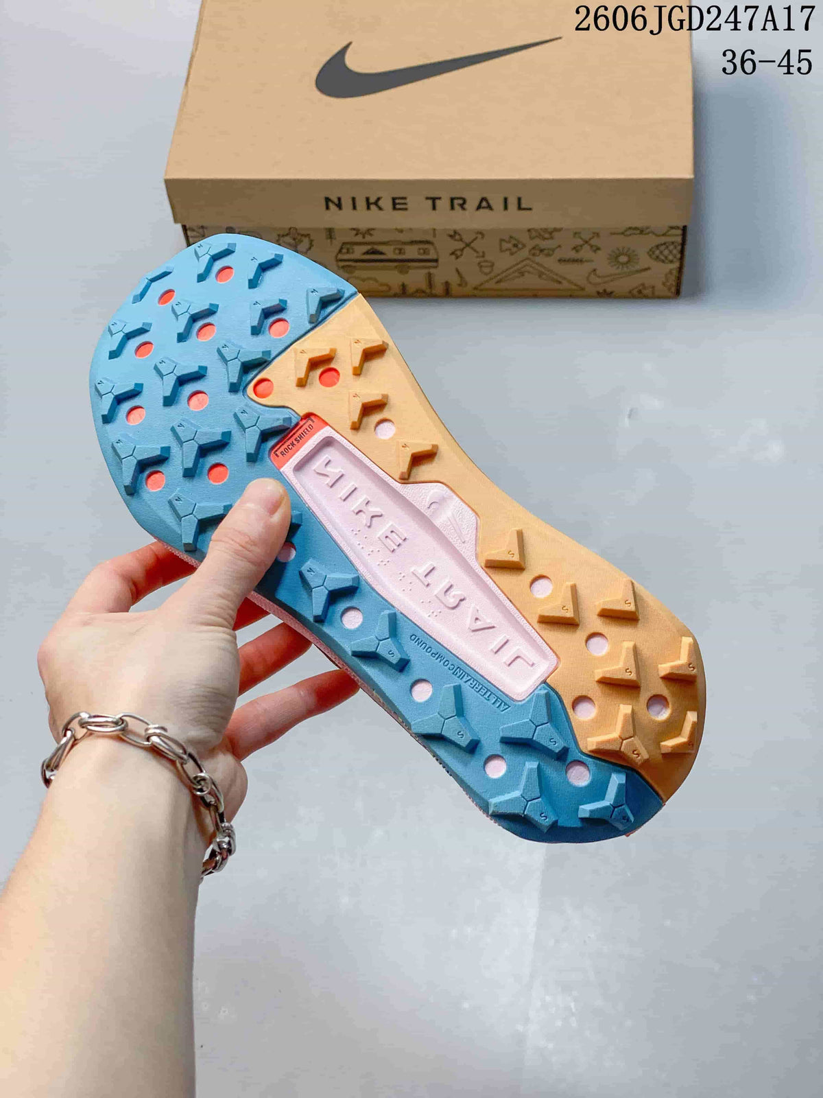 Close-up of the blue and tan lugged outsole