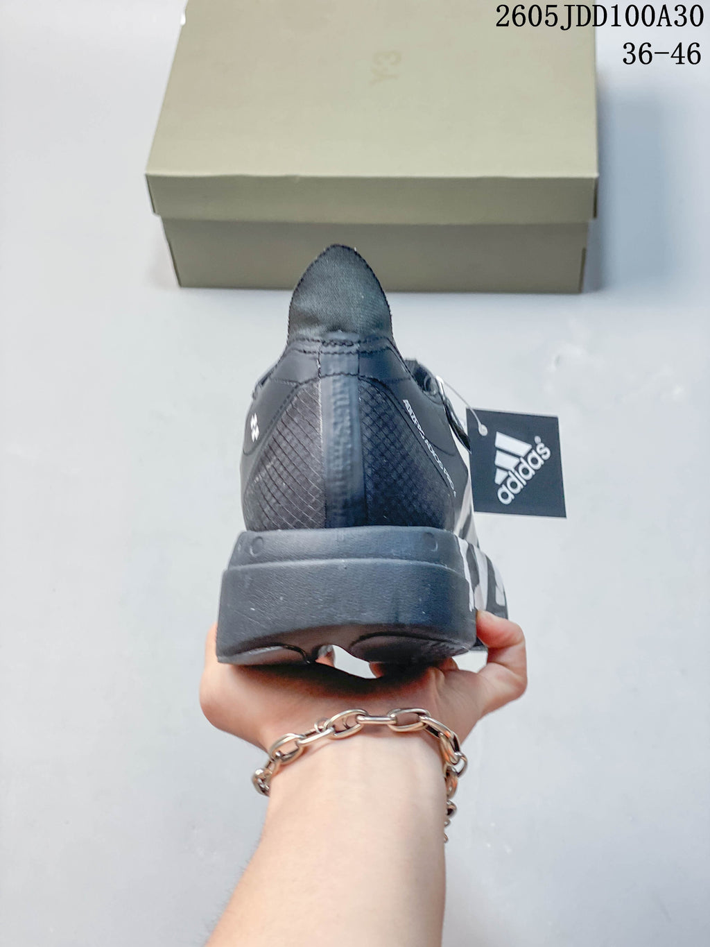 Rear view of a gray running shoe with a sculpted heel