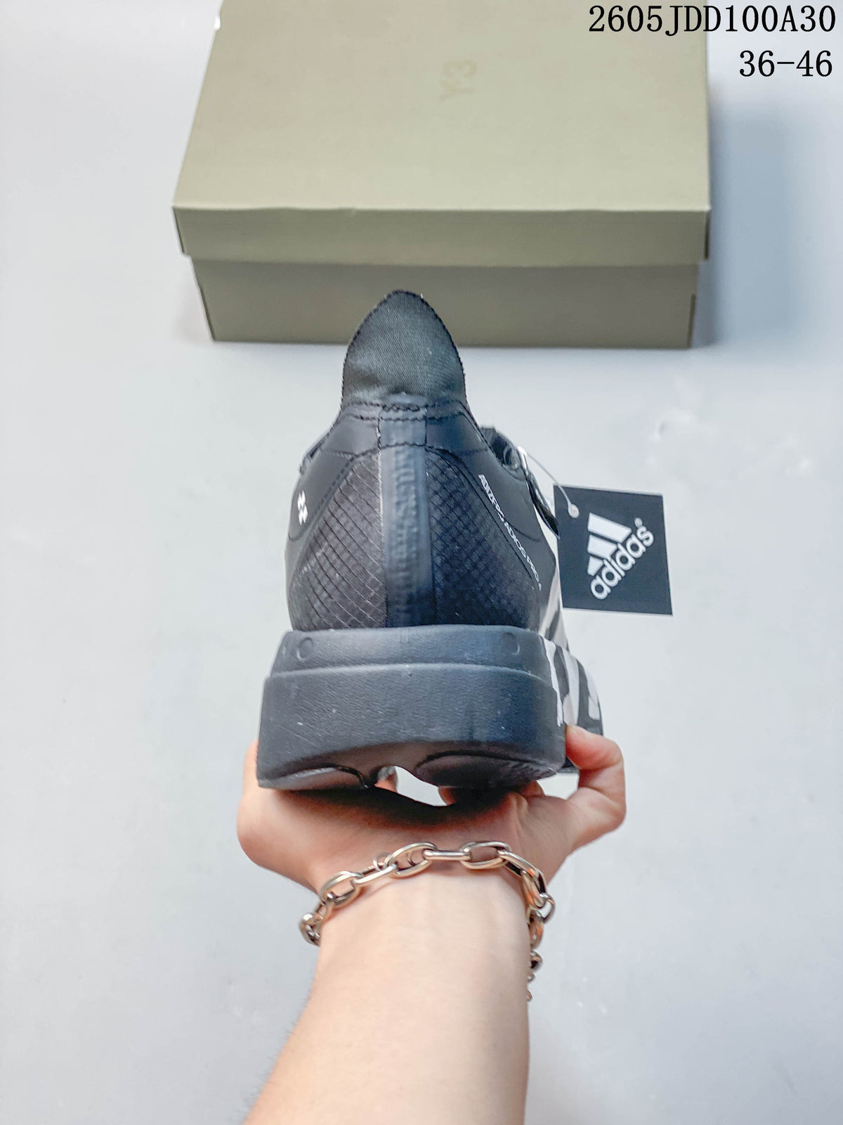 Rear view of a gray running shoe with a sculpted heel