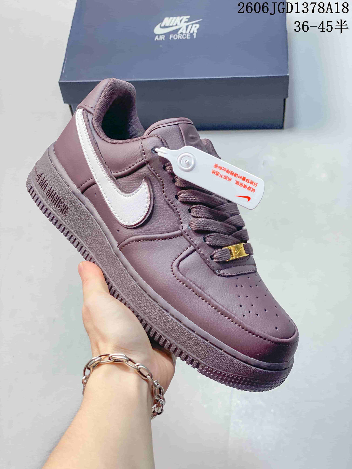 Side view of a mauve Air Force 1 sneaker with a white Swoosh