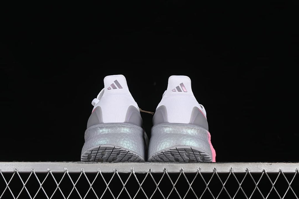 Rear view of the pair showing grey heel details and textured outsoles