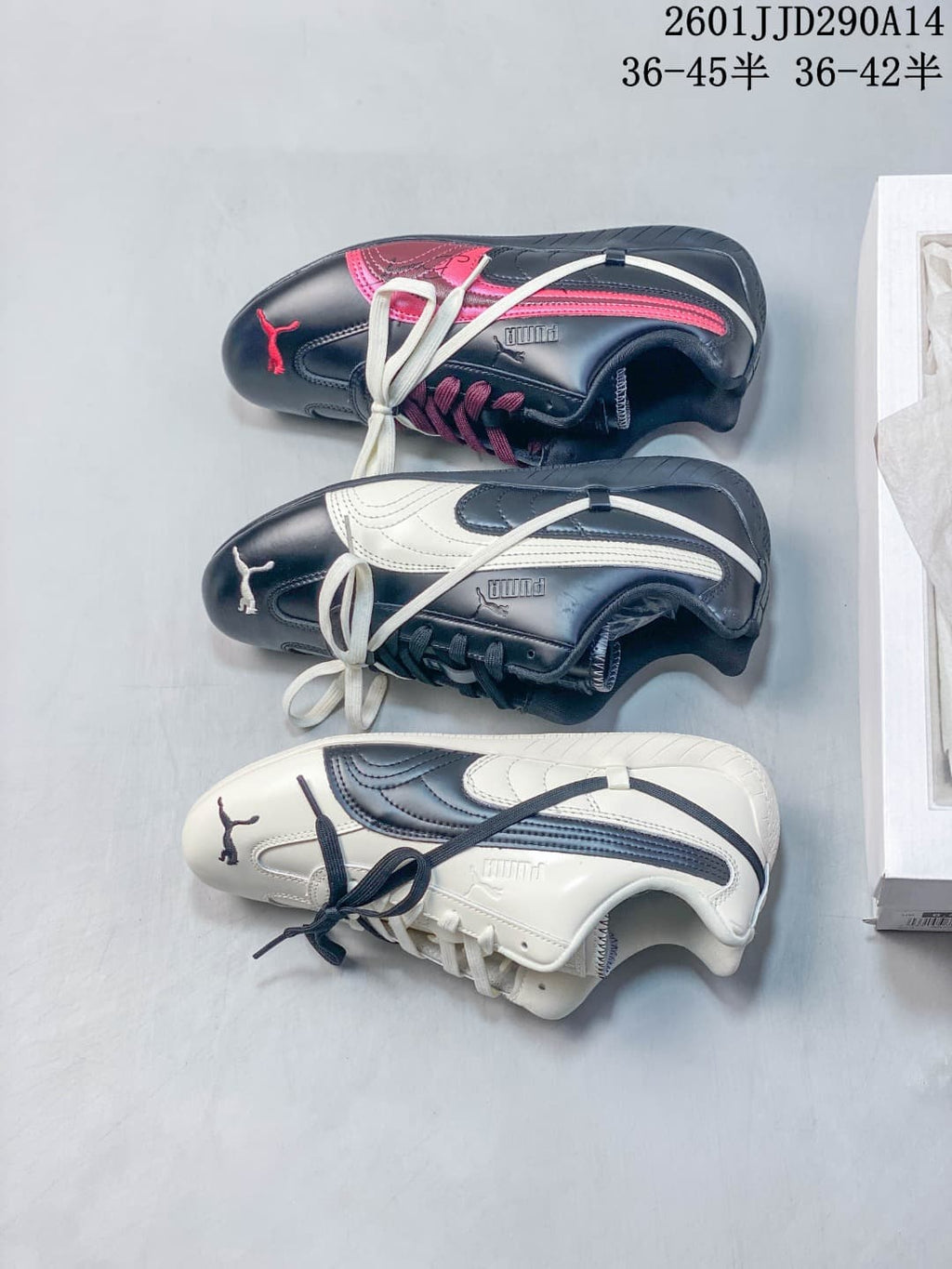 PUMA Speedcat TTF sneaker pair in navy and cream, shown with a white shoe box.