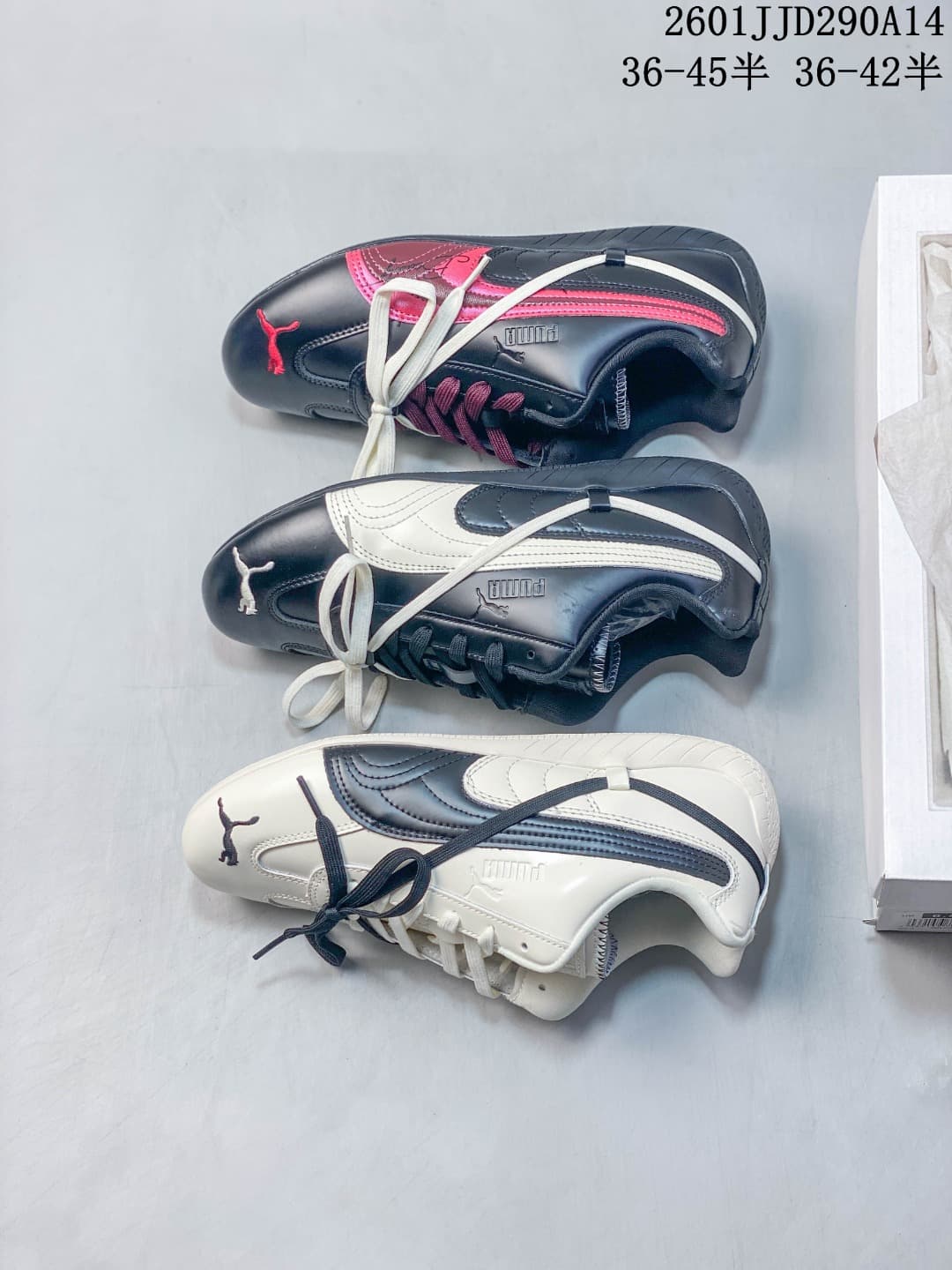 PUMA Speedcat TTF sneaker pair in navy and cream, shown with a white shoe box.