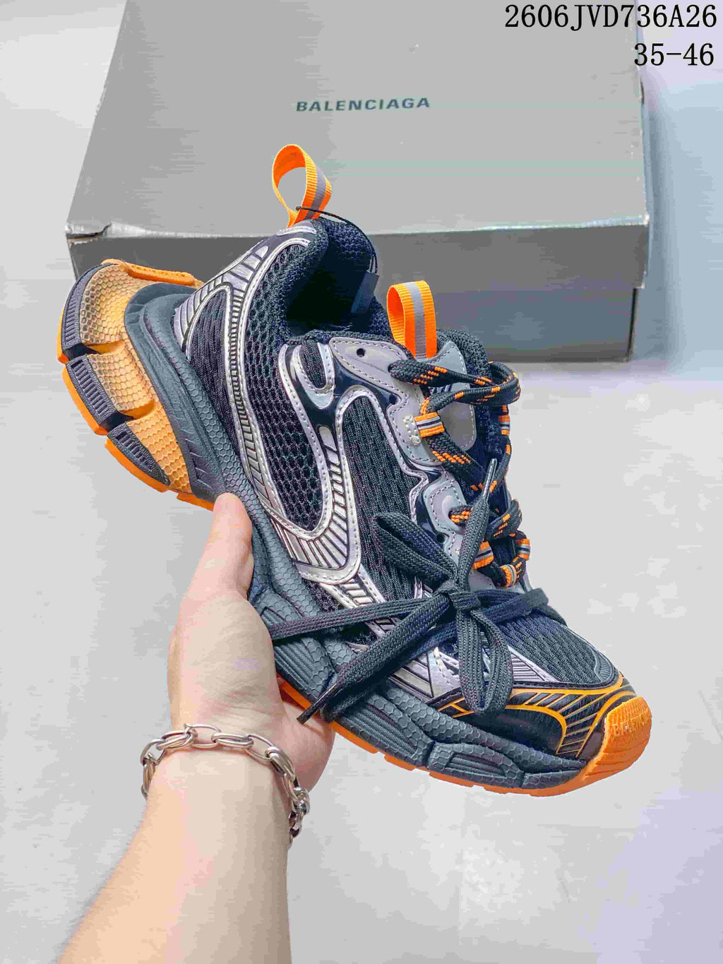 Dark gray Balenciaga 3XL sneaker with orange accents