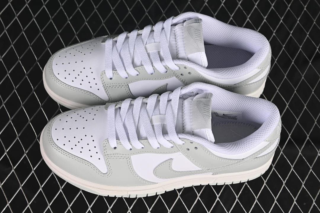 Pair of white and grey low-top sneakers shown from above