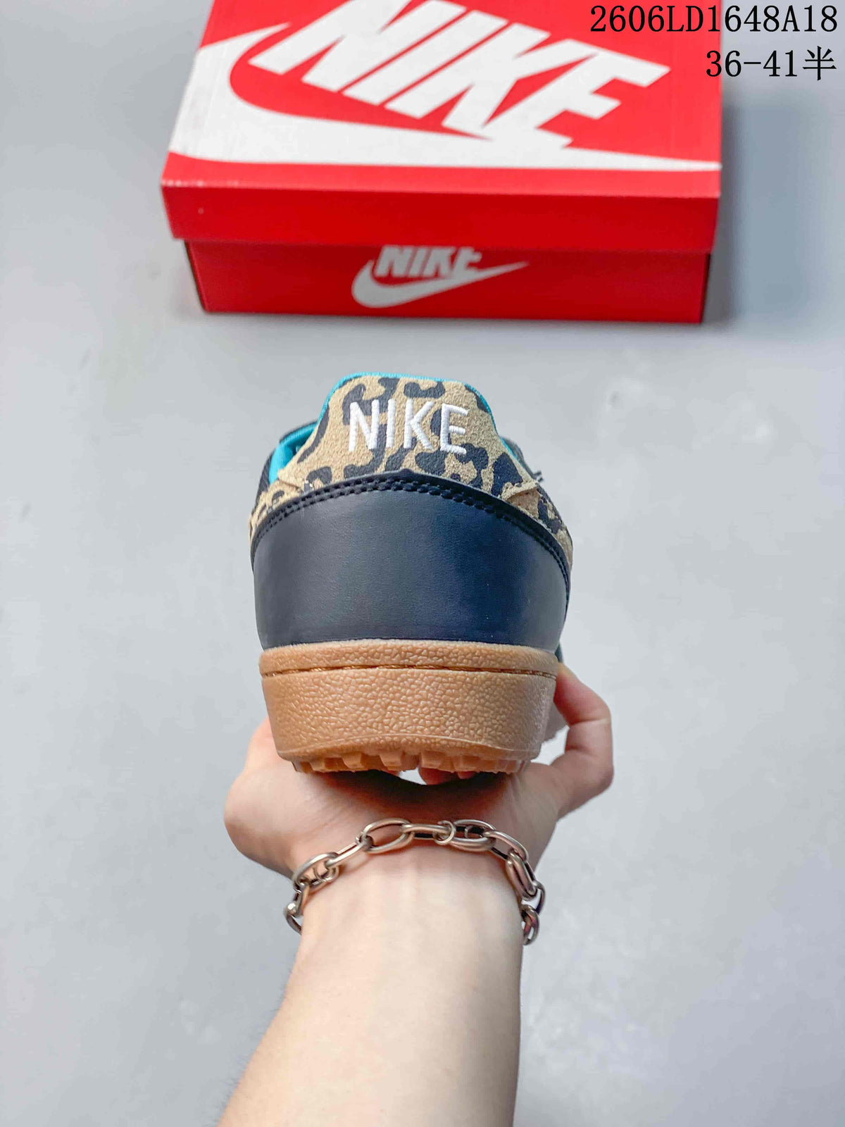 Rear view of the sneaker with leopard-print heel detail and gum-colored sole