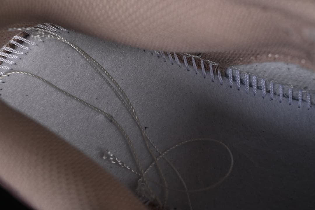 Close-up of interior stitching and lining.