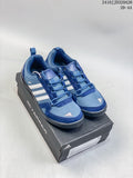 Blue adidas Daroga Plus Canvas shoes with white stripes, shown as a pair on a shoebox.