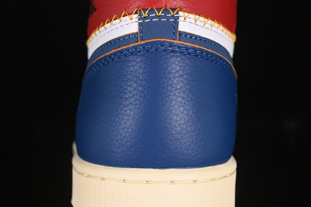 Close-up of the blue heel, white panel, and contrast stitching