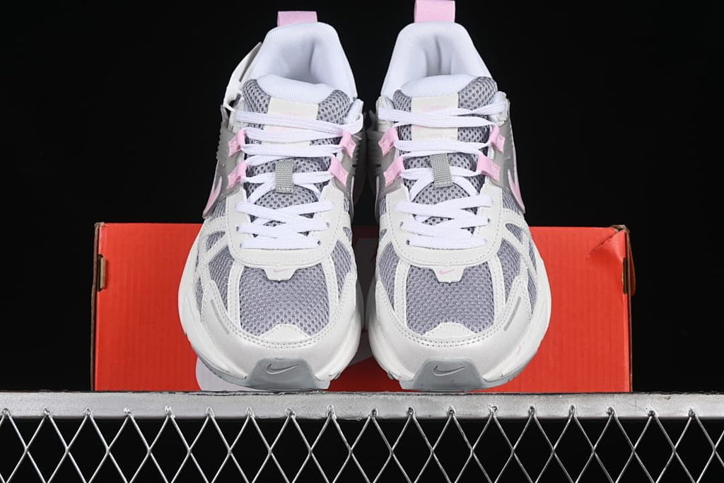 Front view of the pair showing the grey mesh toes and white laces.