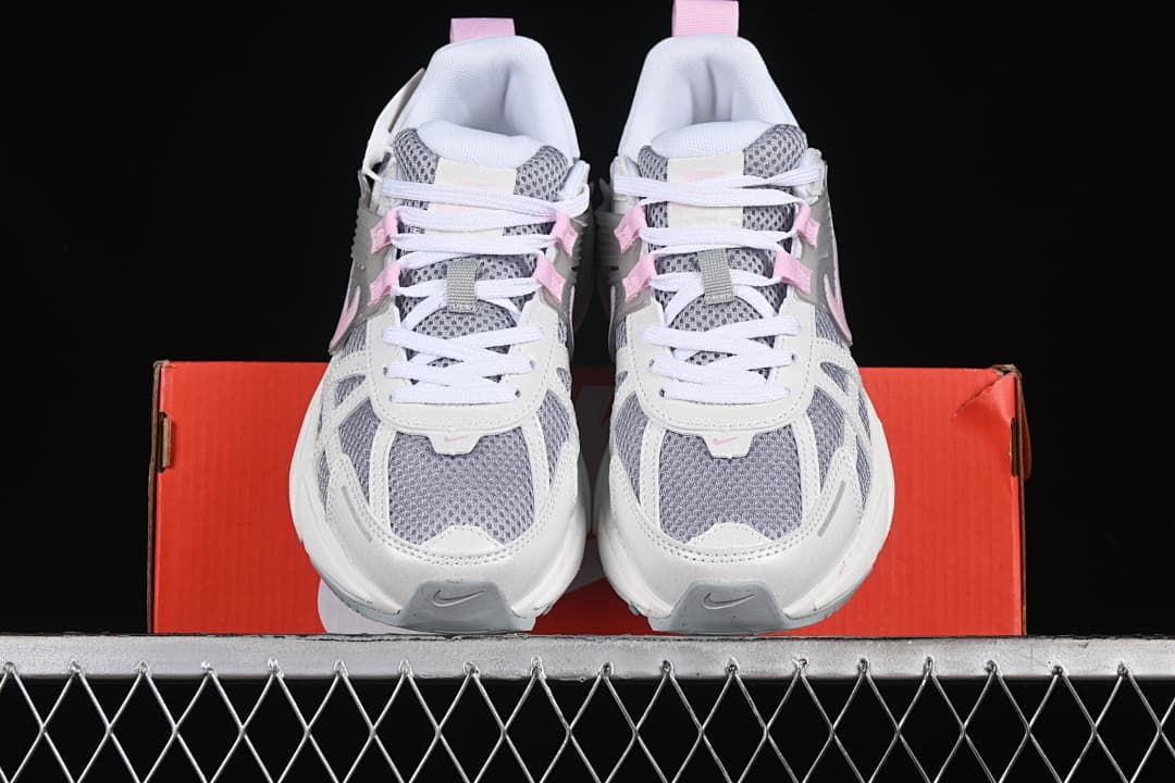 Front view of the pair showing the grey mesh toes and white laces.