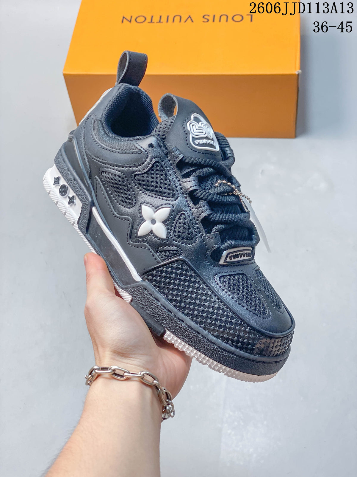 Close side view of the dark navy low-top sneaker showing its layered panels and white side emblem.