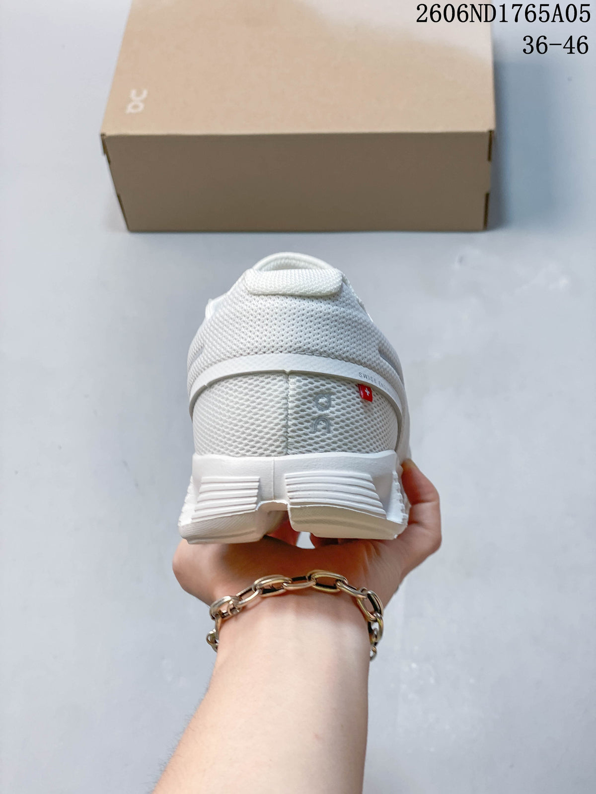 Rear view of a white On Cloud 5 sneaker