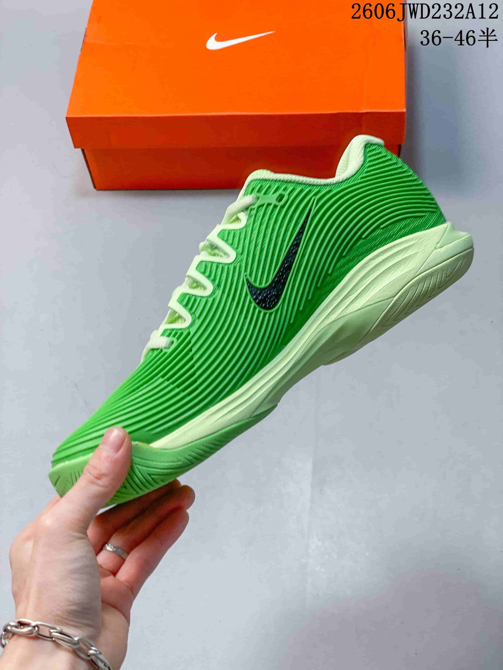 Side view of a green Nike Zoom Vapor 12 HC PRM tennis shoe