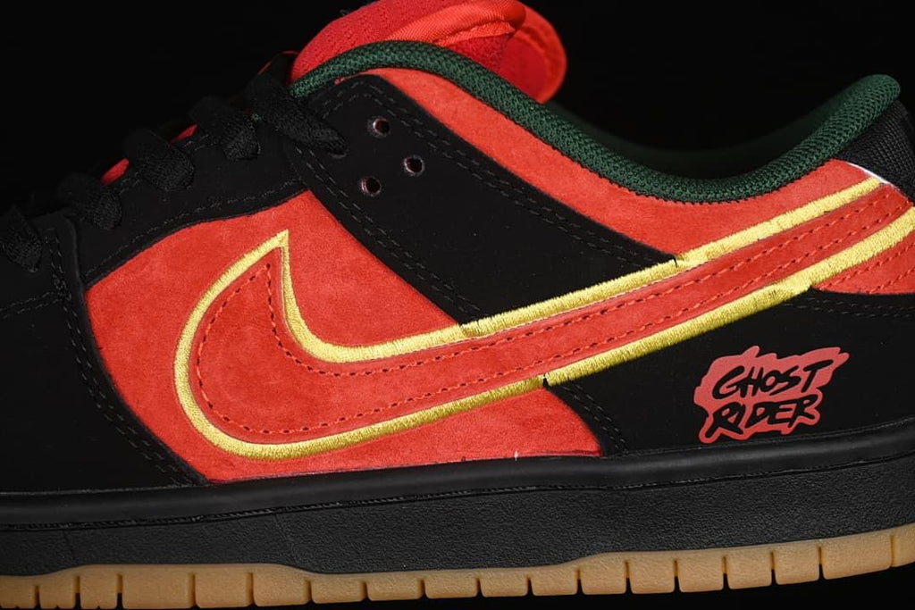 Close-up of the lateral side with red-orange panels, yellow-edged Swoosh, and Ghost Rider heel graphic.