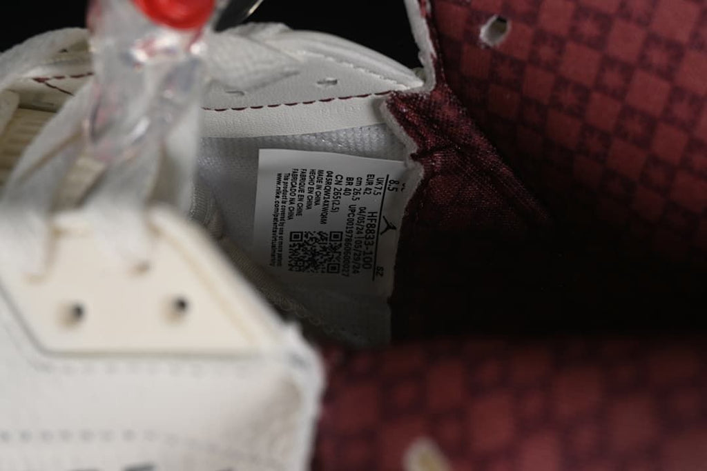 Interior size label and burgundy lining inside the sneaker