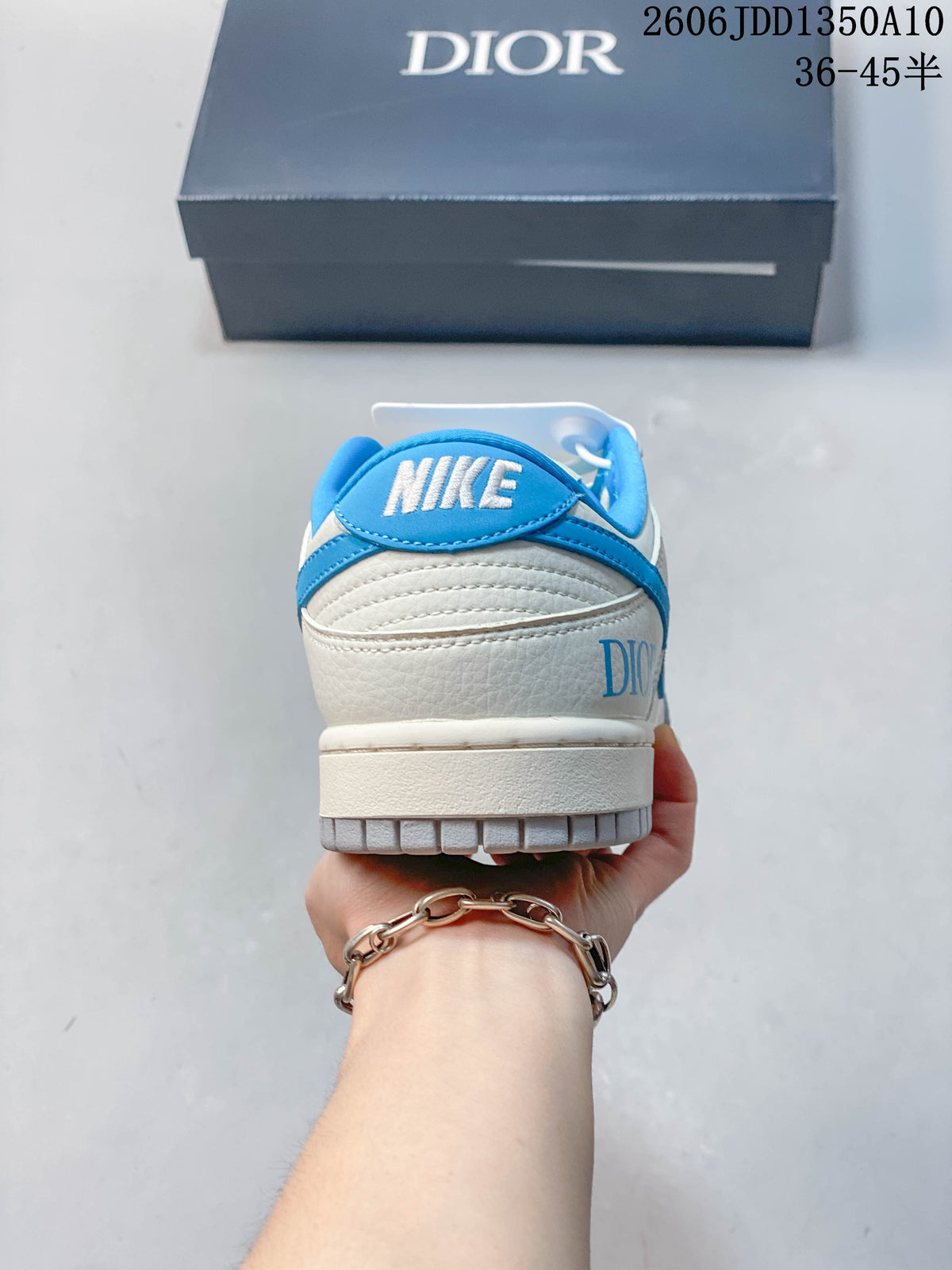 Rear view of the sneaker with blue heel trim and visible Nike and Dior branding.