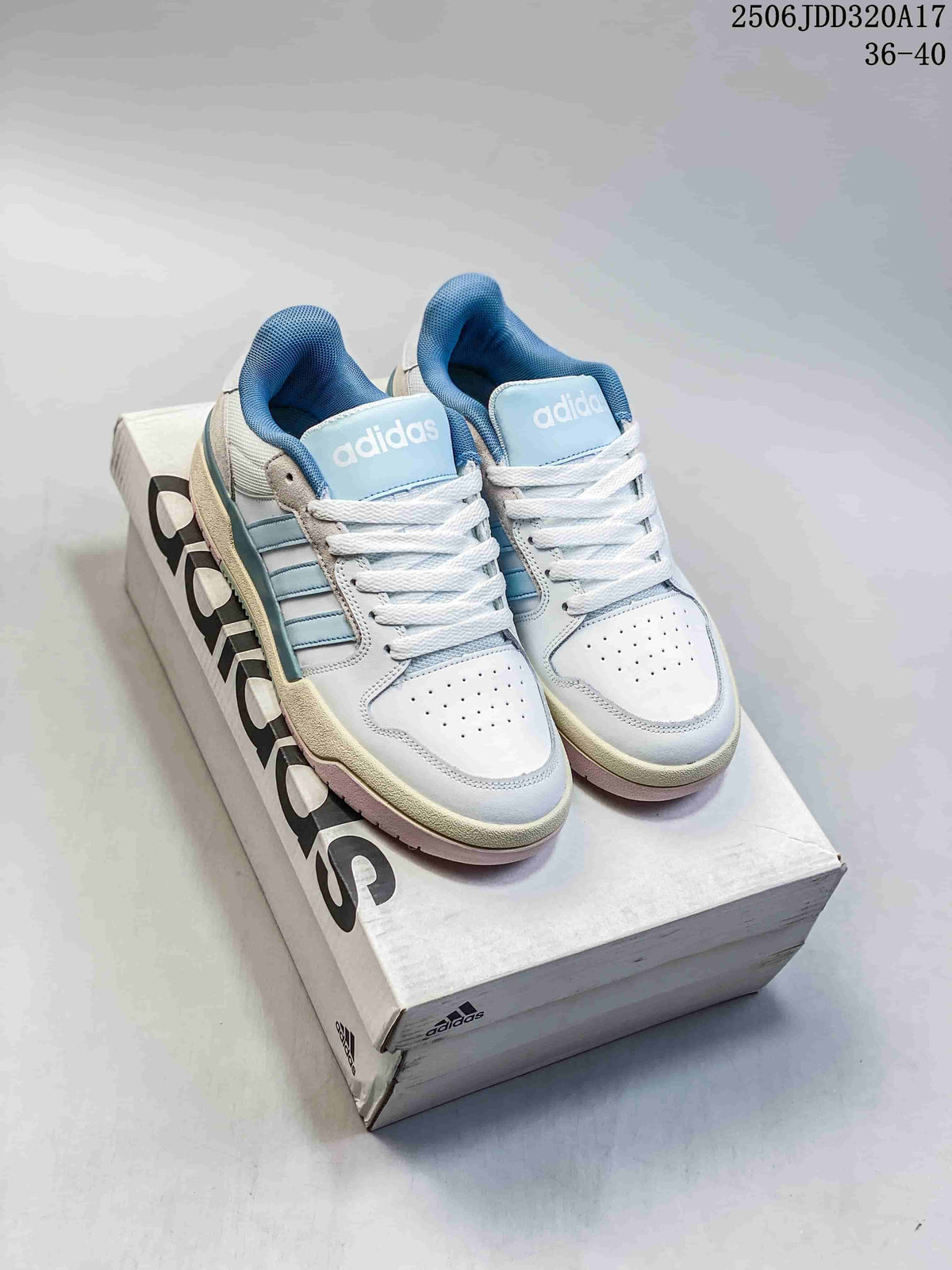 Pair of white and light blue adidas Entrap sneakers on a shoebox.
