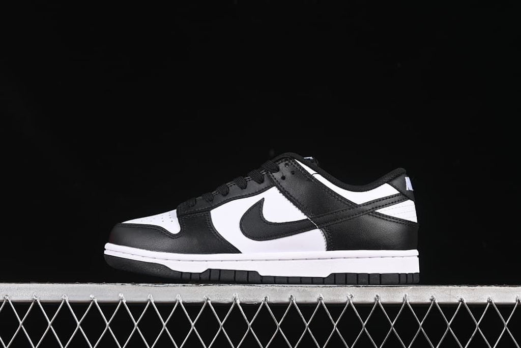 Side profile of a black-and-white Nike SB Dunk Low sneaker