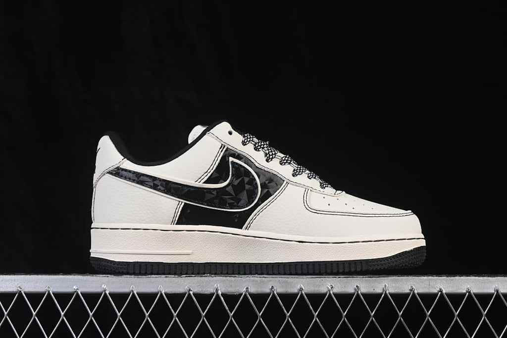 Side profile showing the white low-top sneaker and dark patterned side panel