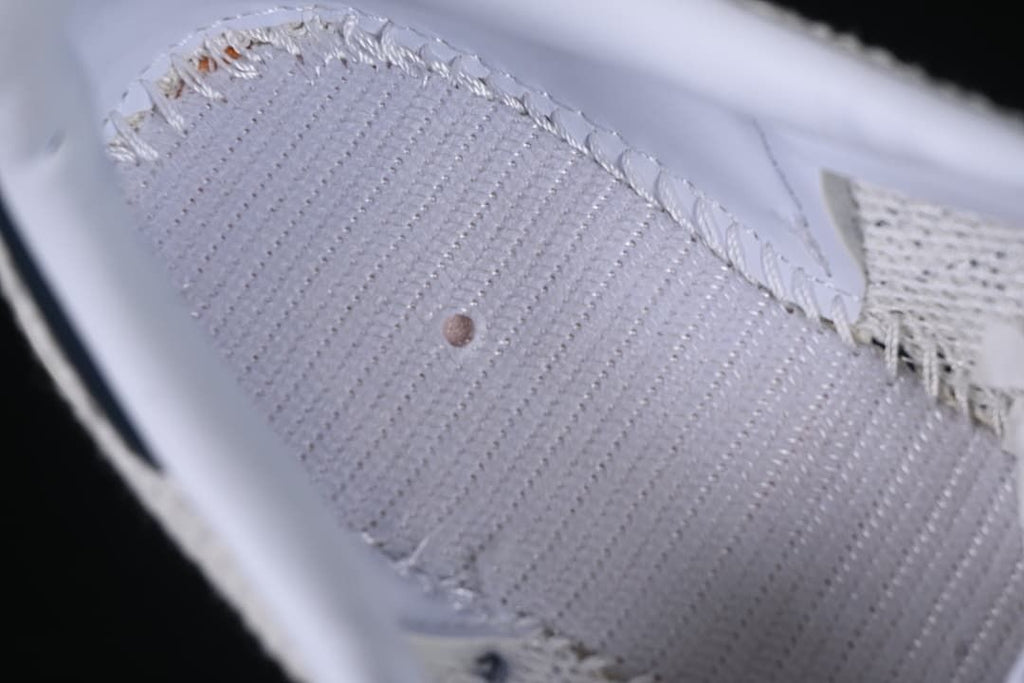 Close-up of textured upper stitching and fabric