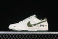 Side view of a white and dark green low-top sneaker with splatter-style swoosh and heel graphics.