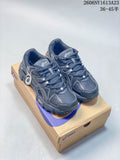 Pair of charcoal ASICS Gel-Kahana 8 FL sneakers on a shoebox