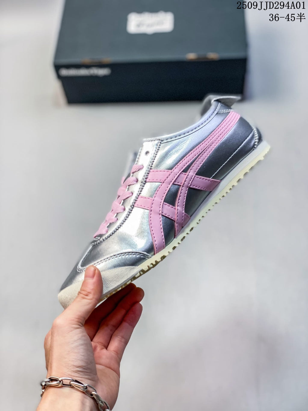 Side view showing pink stripes on the metallic silver sneaker