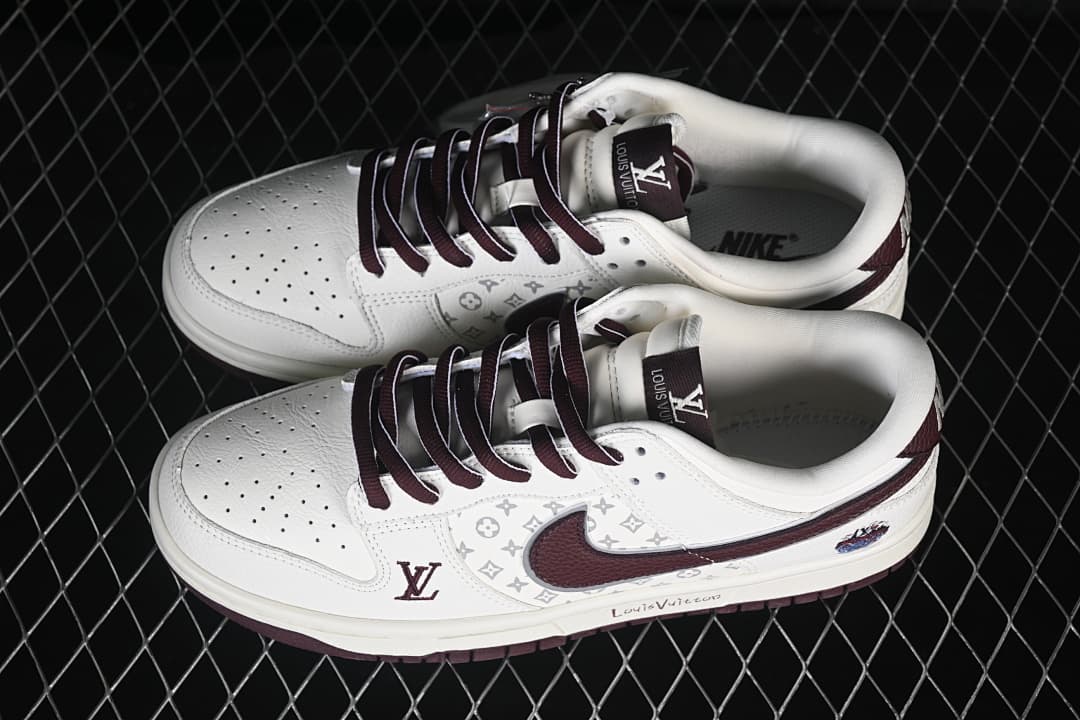 Pair of white low-top sneakers with burgundy laces and Swooshes, gray patterned side panels, and graphic details.