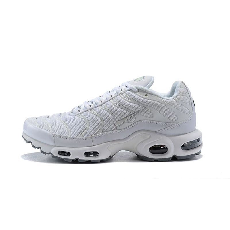 Side view of a white and light gray Nike Air Max Plus-style sneaker.