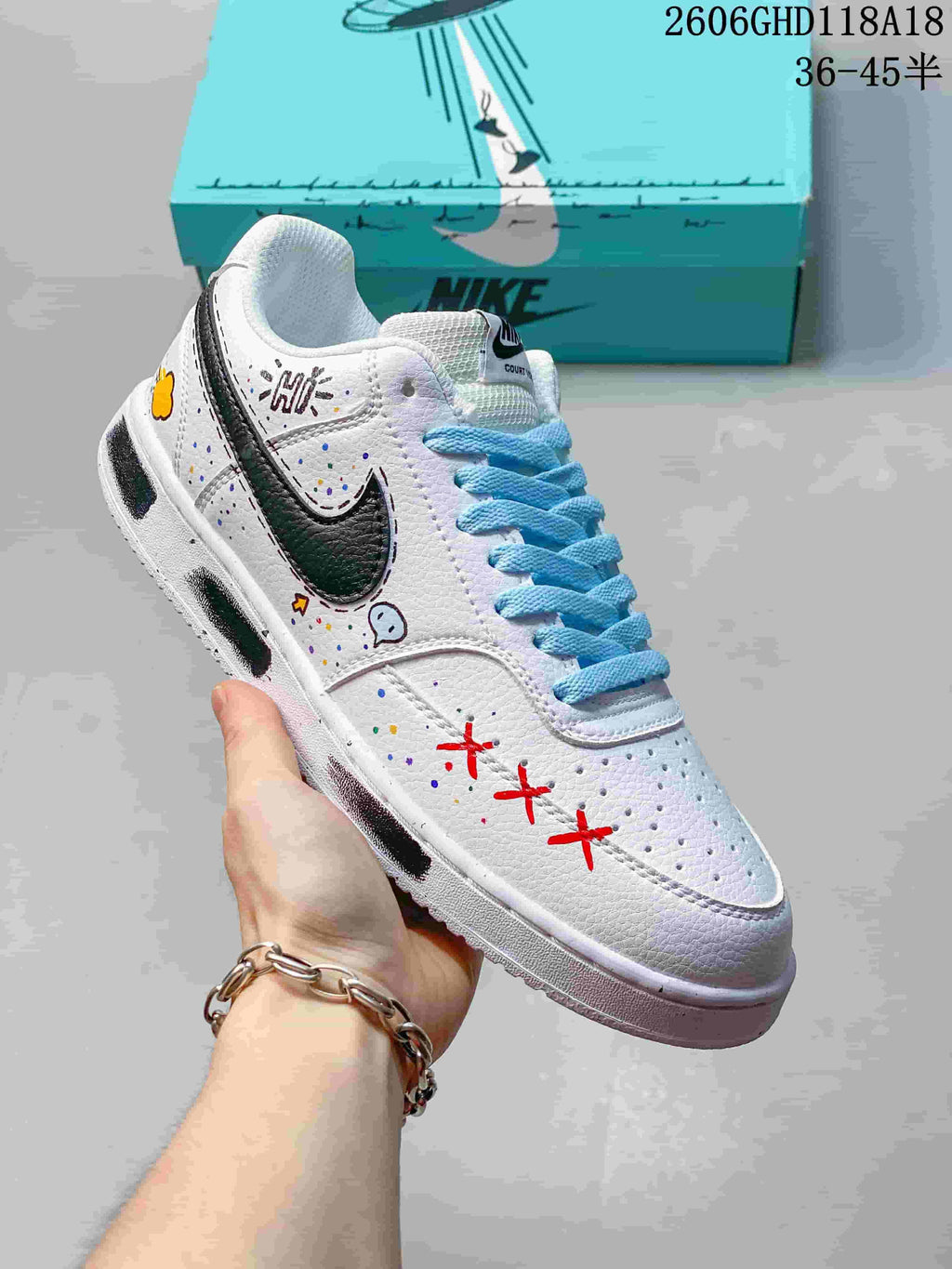 Angled view of the sneaker with dark side swoosh, blue laces, and red accents