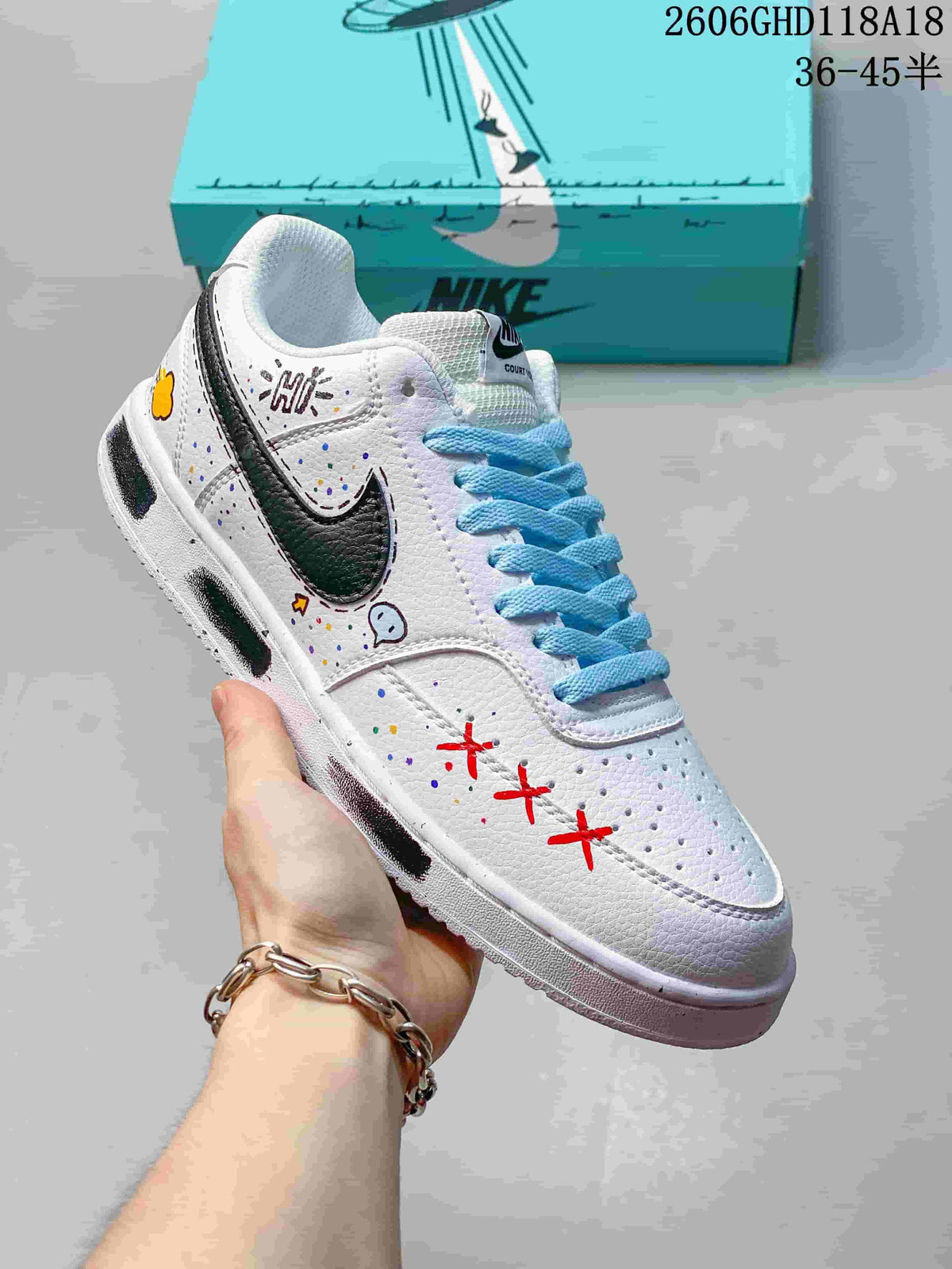 Angled view of the sneaker with dark side swoosh, blue laces, and red accents