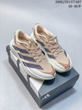 Pair of beige and navy Adidas Adizero Evo SL running shoes displayed on a shoebox.