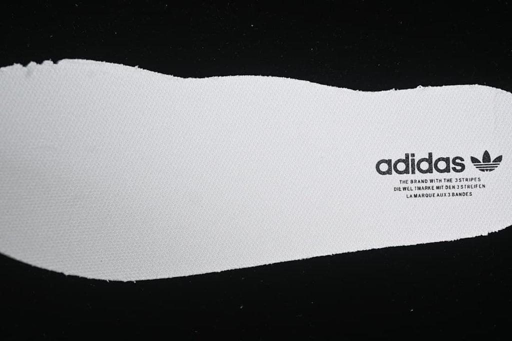 Close-up of the white footbed with adidas branding