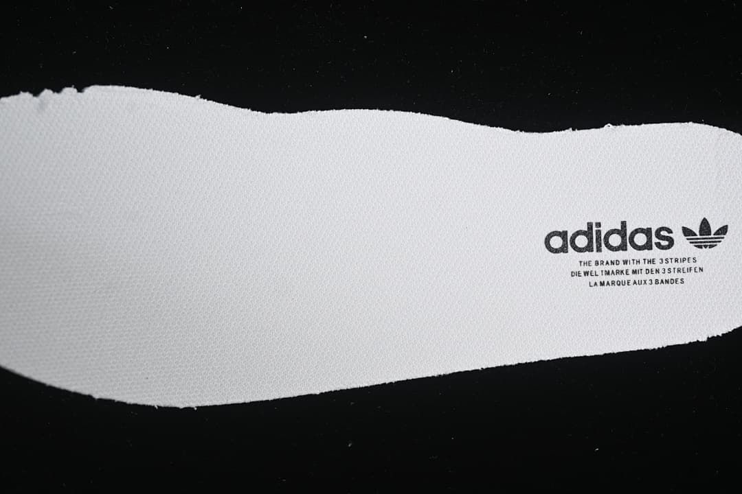 Close-up of the white footbed with adidas branding