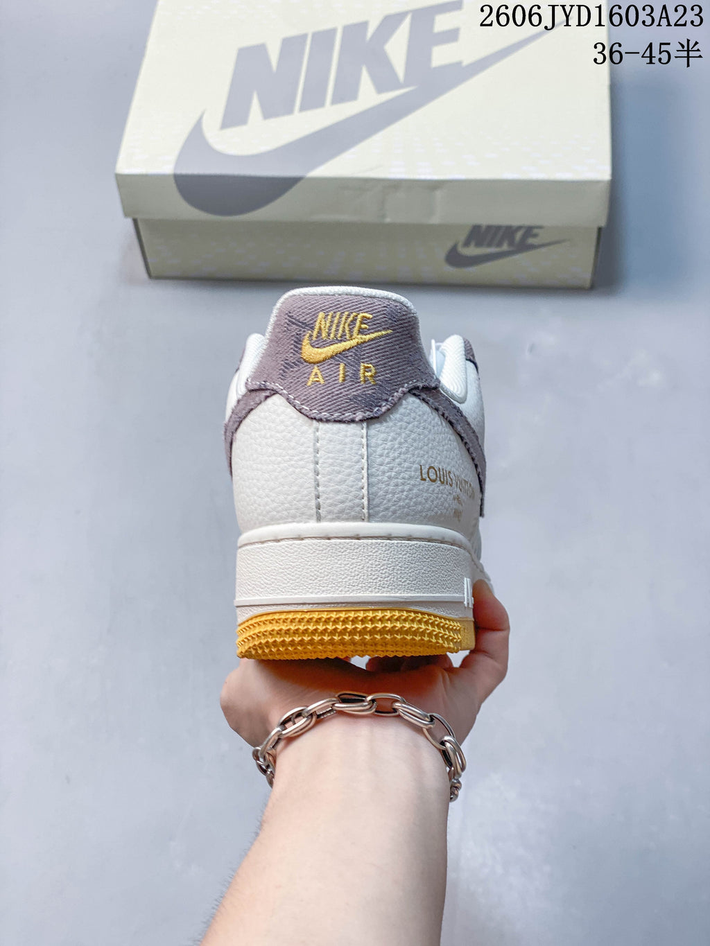 Rear view showing the heel panel and golden gum-colored outsole