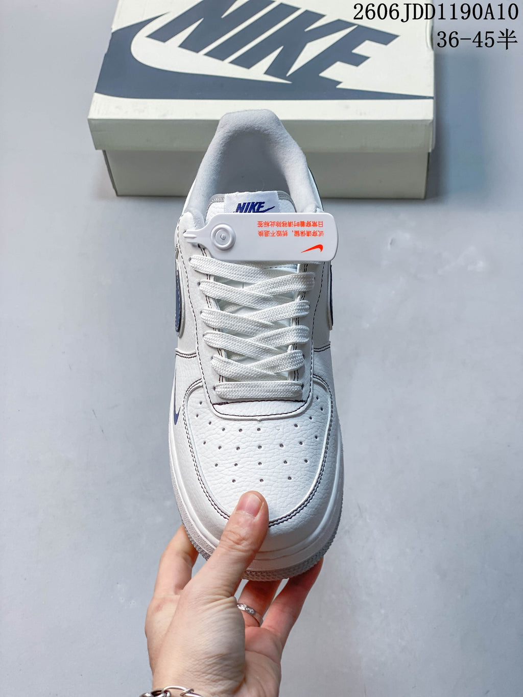 Front view of the sneaker showing its perforated toe and white laces