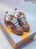 Pair of brown Louis Vuitton Trainer sneakers with white laces and gum-colored soles on a patterned box