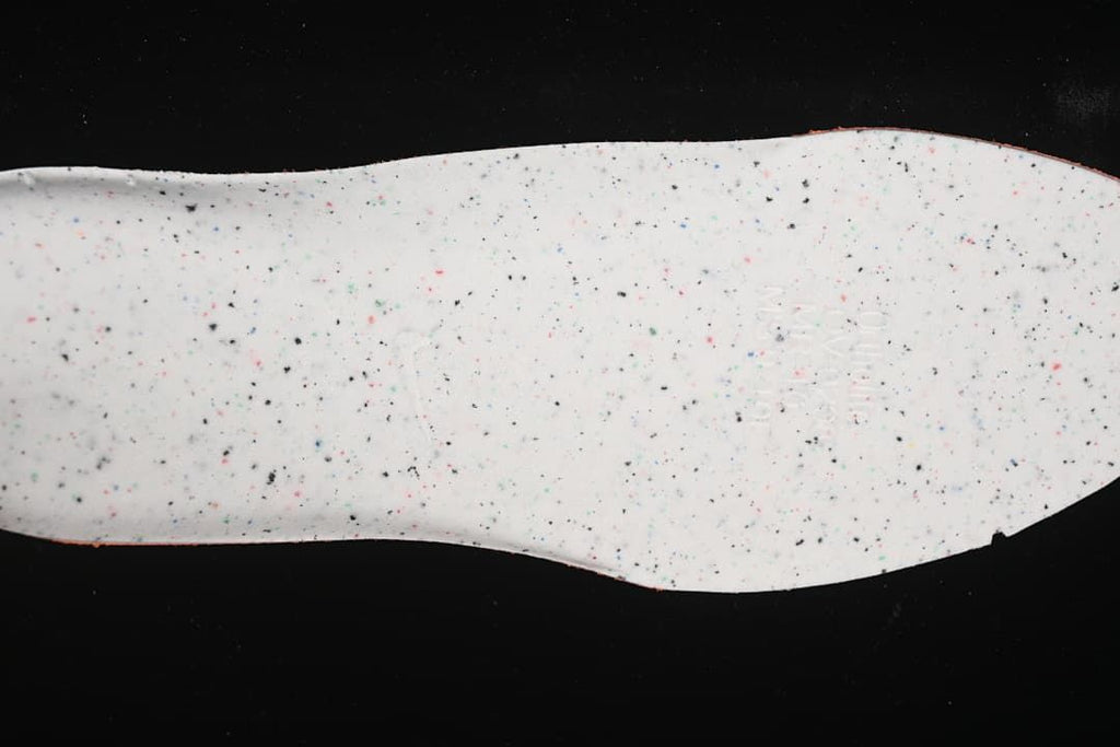 Underside of the shoe's speckled insole